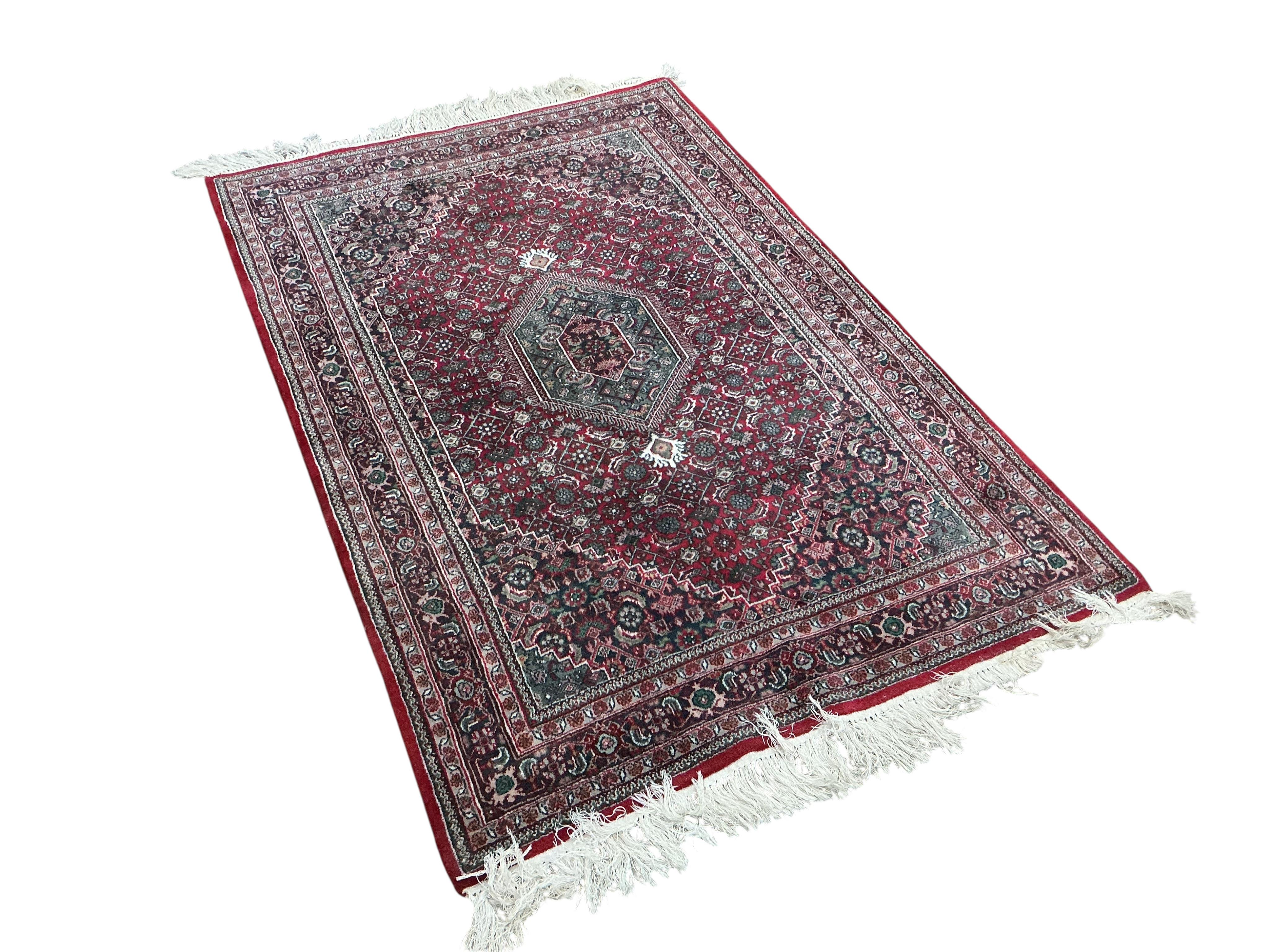 A North West Persian red ground rug